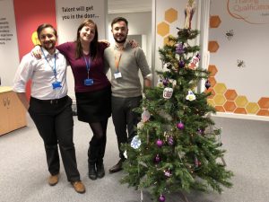 Katy, TJ and Kit in front of the TQUK Christmas tree